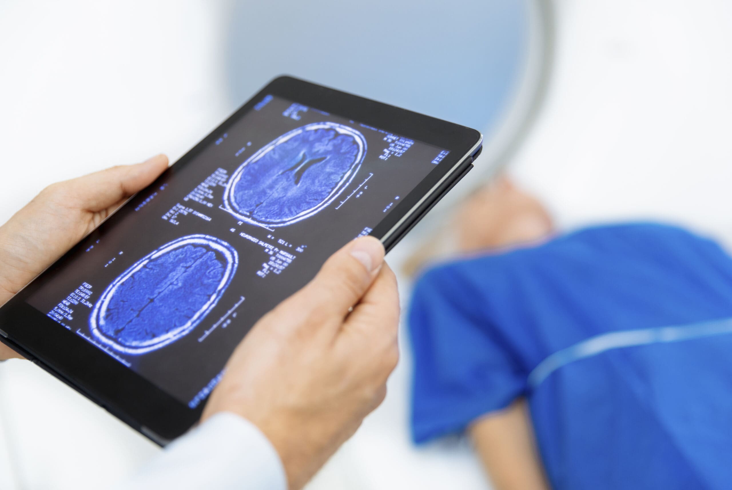 Radiologic technician and Patient being scanned an